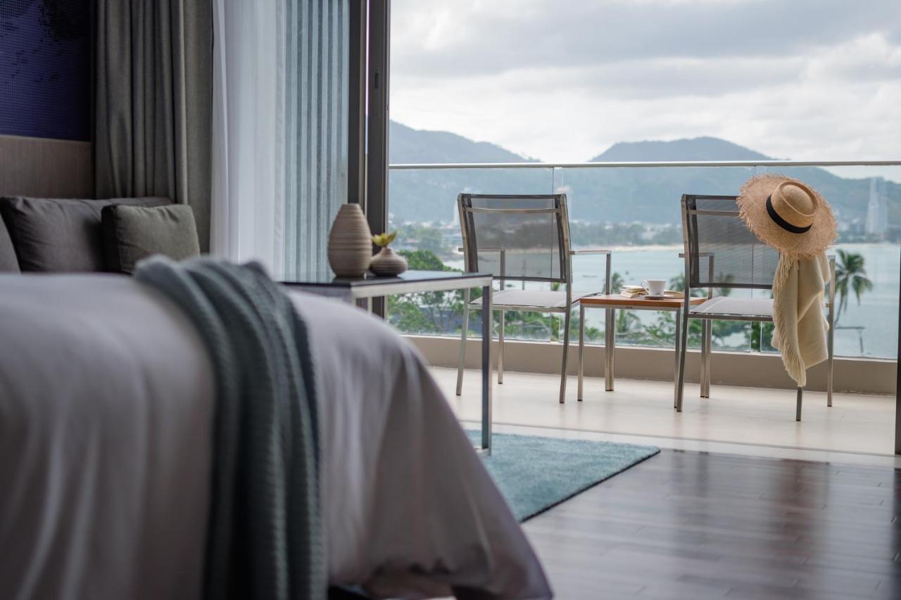 Oceanfront Beach Resort - Sha Extra Plus Patong Ngoại thất bức ảnh A bedroom at The View