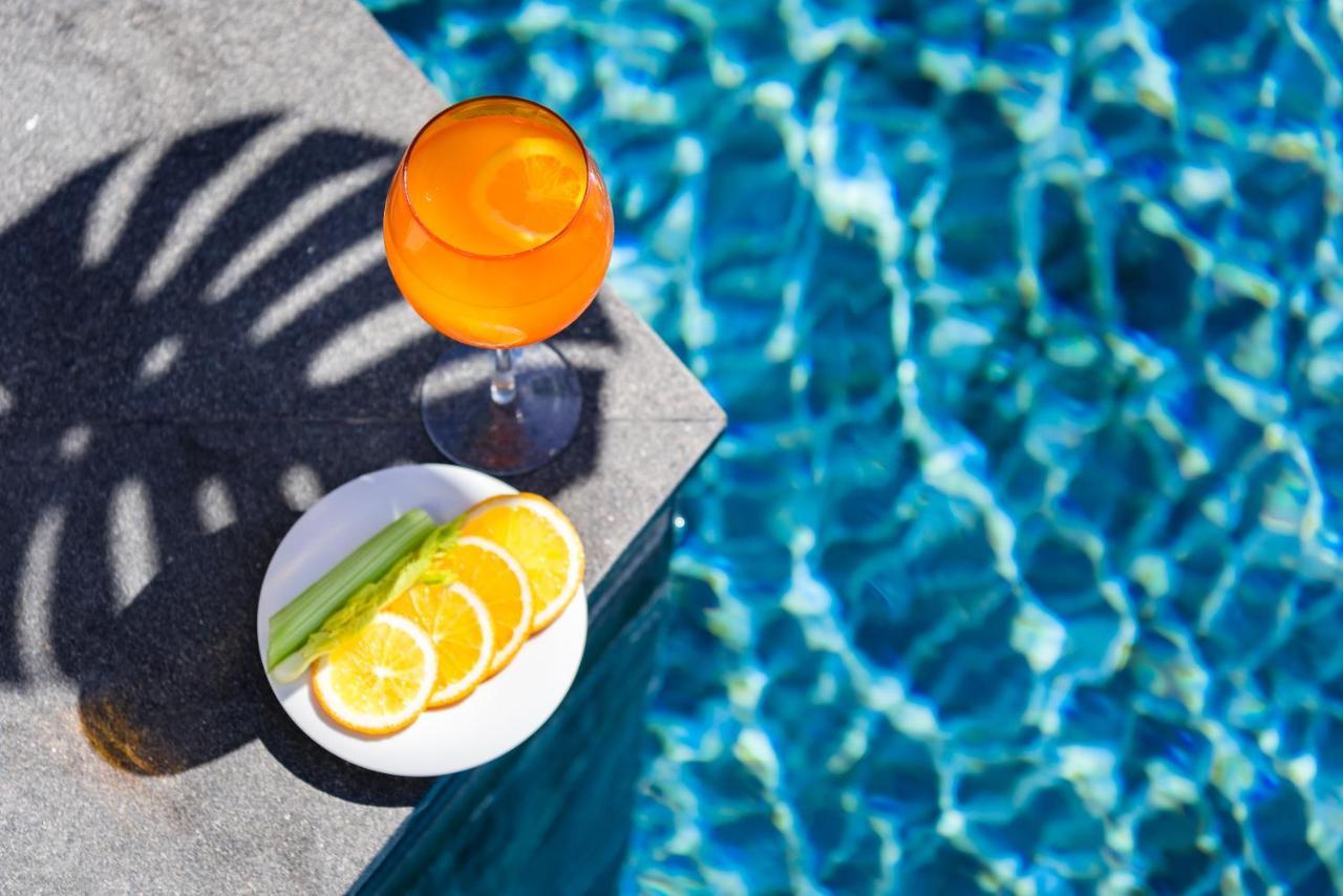 Oceanfront Beach Resort - Sha Extra Plus Patong Ngoại thất bức ảnh A glass of Aperol Spritz